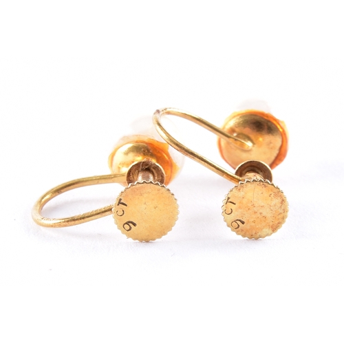 38 - An amber pendant with a yellow gold bale, a pair of 9ct yellow gold pearl screw back earrings, toget... 