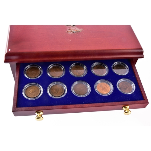 109 - A small collection of silver coins and farthings, twenty in total, housed in a miniature set of coll... 