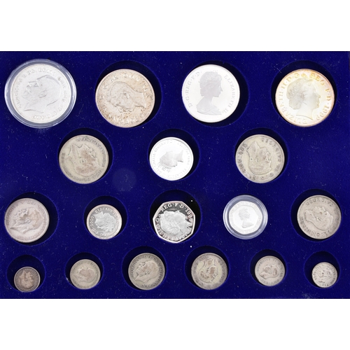 109 - A small collection of silver coins and farthings, twenty in total, housed in a miniature set of coll... 
