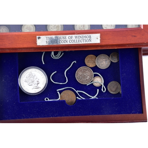 109 - A small collection of silver coins and farthings, twenty in total, housed in a miniature set of coll... 