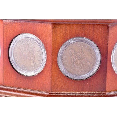 109 - A small collection of silver coins and farthings, twenty in total, housed in a miniature set of coll... 