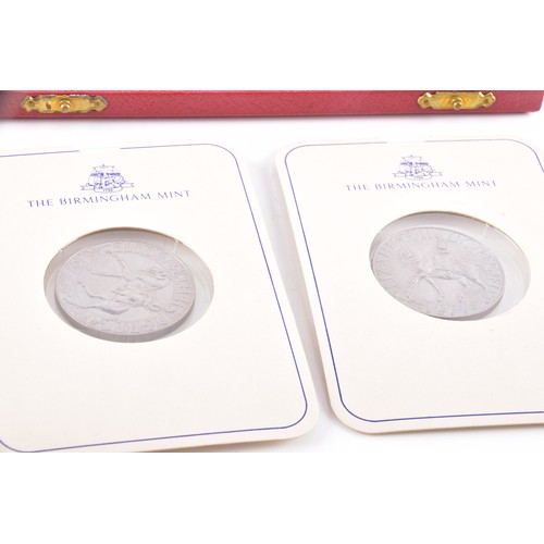 212 - A Henley gilt carriage clock with key, 11 cm high, two commemorative crowns, a silver engraved bangl... 