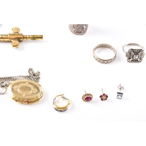 212 - A Henley gilt carriage clock with key, 11 cm high, two commemorative crowns, a silver engraved bangl... 