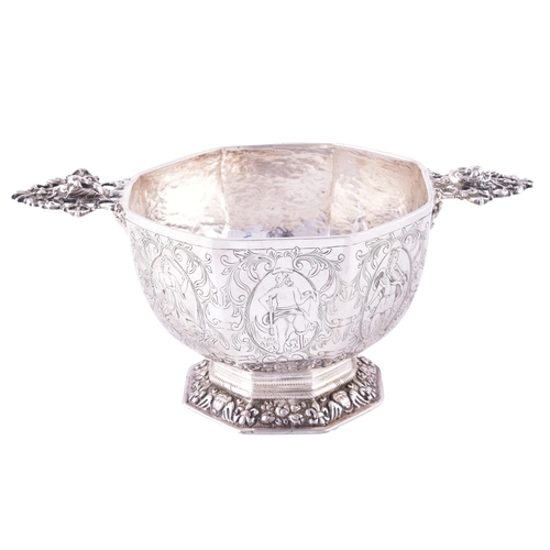 171 - A continental silver quaich, of octagonal form with flared sides, the exterior finely engraved with ... 