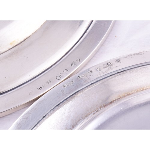 145 - A set of twelve continental 800 silver finger bowls, 12 cm diameter, twelve small plates, 16 cm diam... 