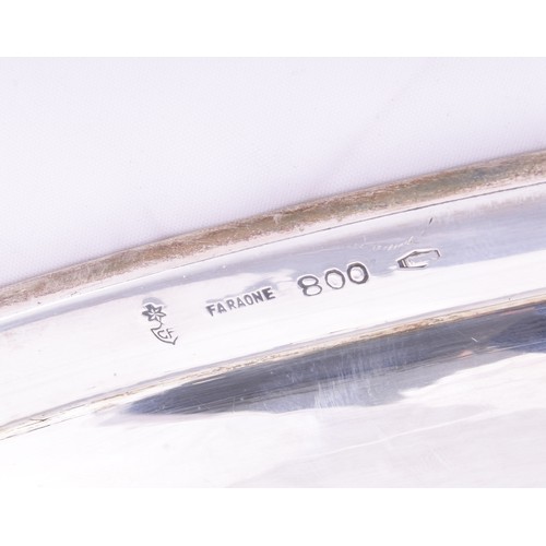 148 - A continental 800 silver large tray, with a plain polished surface, within a narrow border decorated... 