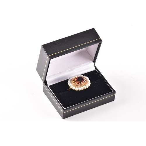 49 - A yellow gold citrine and pearl brooch, centred with a large rectangular cushion cut citrine in a cl... 