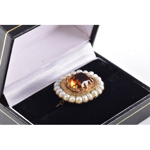 49 - A yellow gold citrine and pearl brooch, centred with a large rectangular cushion cut citrine in a cl... 