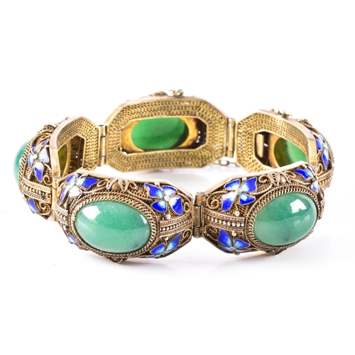 50 - A silver gilt Chinese export cloisonne fiigree bracelet featuring jadeite cabochons, surrounded by b... 