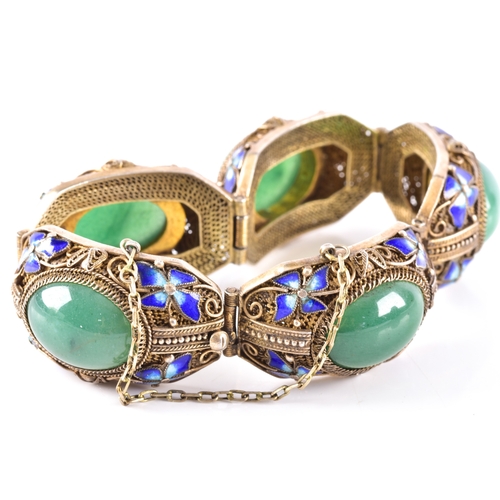 50 - A silver gilt Chinese export cloisonne fiigree bracelet featuring jadeite cabochons, surrounded by b... 