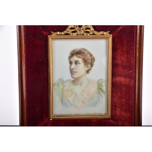236 - A late Victorian portrait of a lady, depicting a lady with a fine pearl hair pin, wearing a pastel c... 