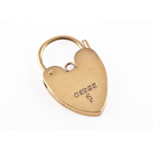 55 - A collection of gold charms, including a 9ct glass set decorative fob charm, a 9ct yellow gold smoky... 