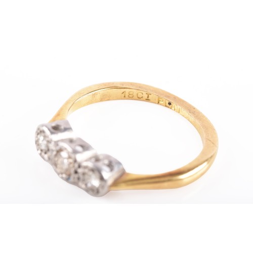 57 - An 18ct yellow gold and platinum diamond three stone ring, set with three graduating round brilliant... 