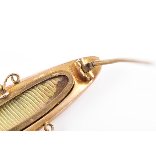 58 - A Victorian 9ct yellow gold synthetic sapphire and seed pearl brooch, featuring decorative metalwork... 