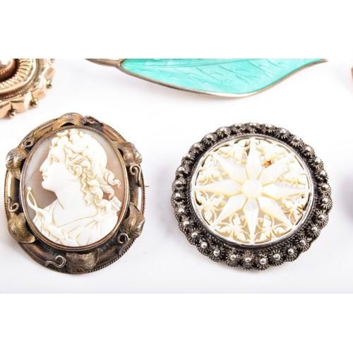 59 - A David Anderson green enamel leaf brooch, Victorian style yellow metal brooch, a pair of yellow met... 