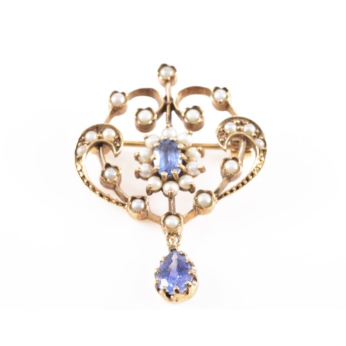 60 - A 9ct yellow gold Art Nouveau style seed pearl and blue stone brooch, featuring intricate gold work ... 