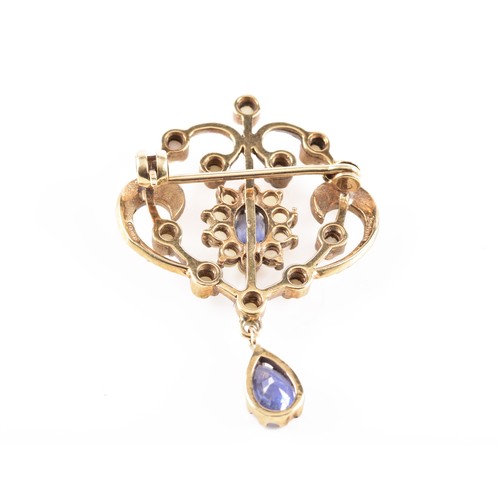 60 - A 9ct yellow gold Art Nouveau style seed pearl and blue stone brooch, featuring intricate gold work ... 