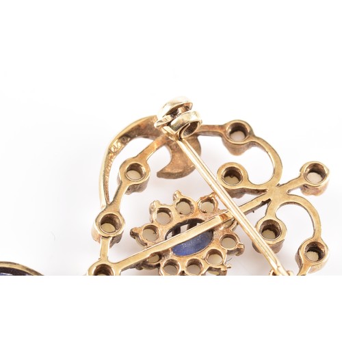 60 - A 9ct yellow gold Art Nouveau style seed pearl and blue stone brooch, featuring intricate gold work ... 