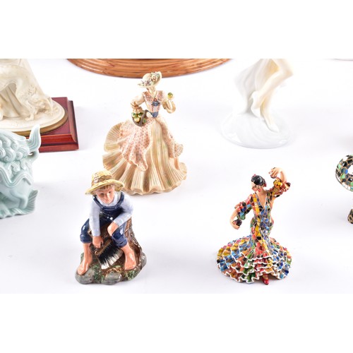 338 - A large collection of ceramics and figurines, including a Marco Giner Spain porcelain lady with flow... 