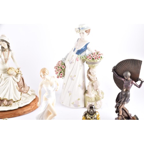 338 - A large collection of ceramics and figurines, including a Marco Giner Spain porcelain lady with flow... 