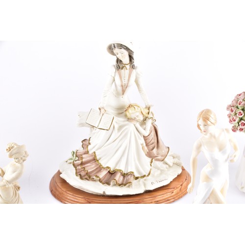 338 - A large collection of ceramics and figurines, including a Marco Giner Spain porcelain lady with flow... 