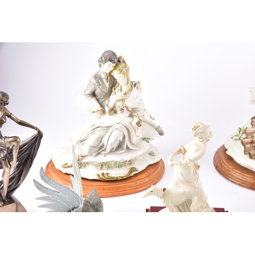 338 - A large collection of ceramics and figurines, including a Marco Giner Spain porcelain lady with flow... 