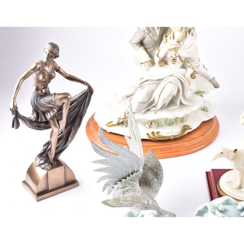 338 - A large collection of ceramics and figurines, including a Marco Giner Spain porcelain lady with flow... 