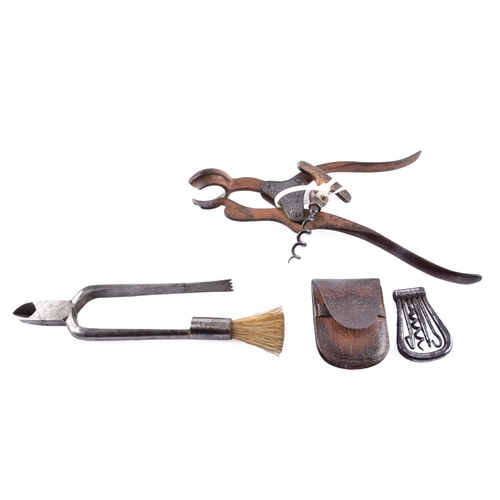 219 - A pair of champagne nippers, featuring pliers at one end to cut the wire and an integrated dusting b... 