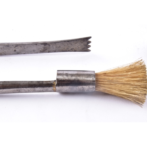 219 - A pair of champagne nippers, featuring pliers at one end to cut the wire and an integrated dusting b... 