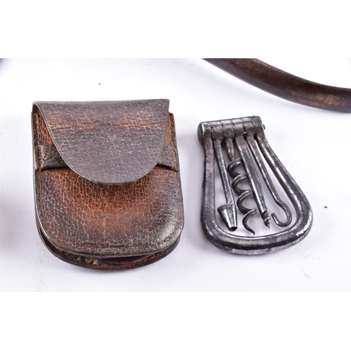 219 - A pair of champagne nippers, featuring pliers at one end to cut the wire and an integrated dusting b... 