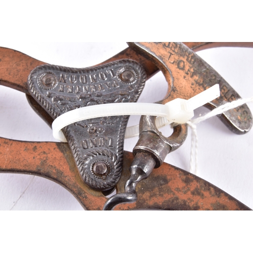 219 - A pair of champagne nippers, featuring pliers at one end to cut the wire and an integrated dusting b... 