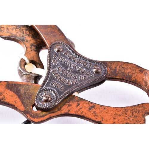 219 - A pair of champagne nippers, featuring pliers at one end to cut the wire and an integrated dusting b... 