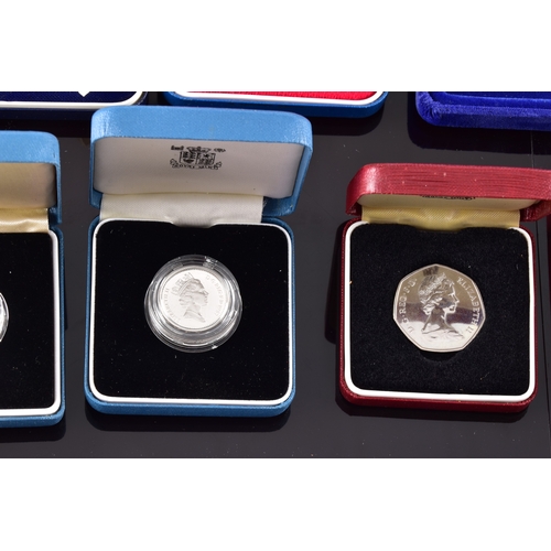 99 - A collection of coins, including four cased United Kingdom silver proof one pound coins, a cased 197... 