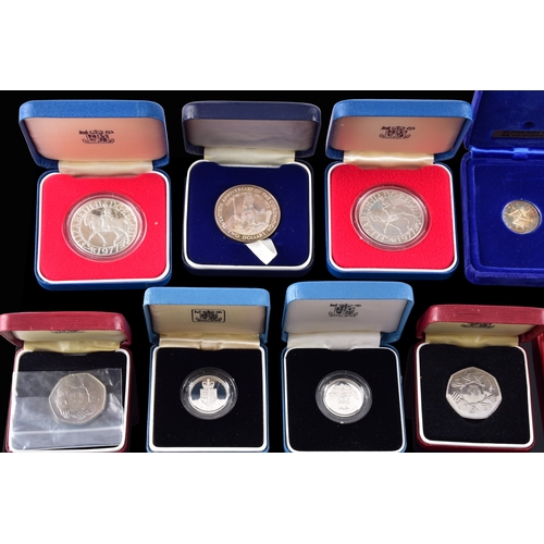 99 - A collection of coins, including four cased United Kingdom silver proof one pound coins, a cased 197... 