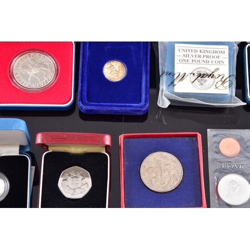99 - A collection of coins, including four cased United Kingdom silver proof one pound coins, a cased 197... 