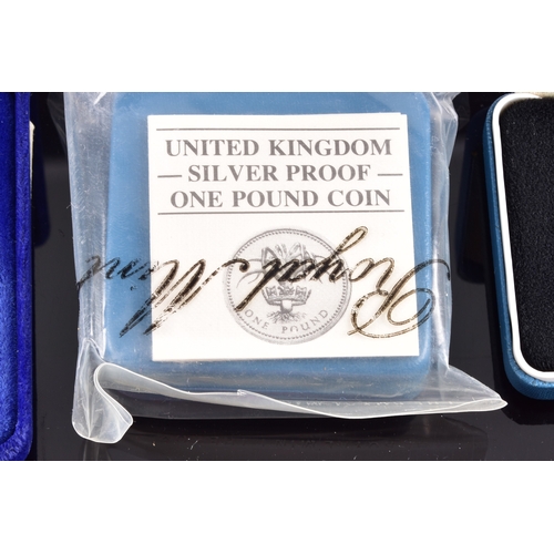 99 - A collection of coins, including four cased United Kingdom silver proof one pound coins, a cased 197... 