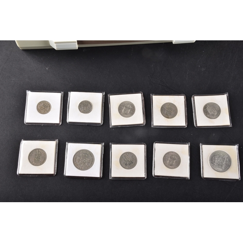 99 - A collection of coins, including four cased United Kingdom silver proof one pound coins, a cased 197... 