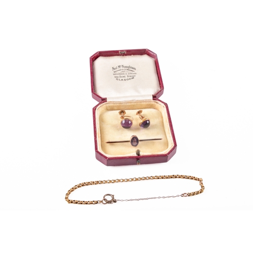 74 - A 9ct yellow gold amethyst bar brooch, 4.7 cm long, a pair of yellow metal cabochon amethyst screw o... 