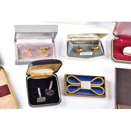 48 - A large collection of costume jewellery, cufflinks, brooches, watches, tie clips, travel clocks, nec... 