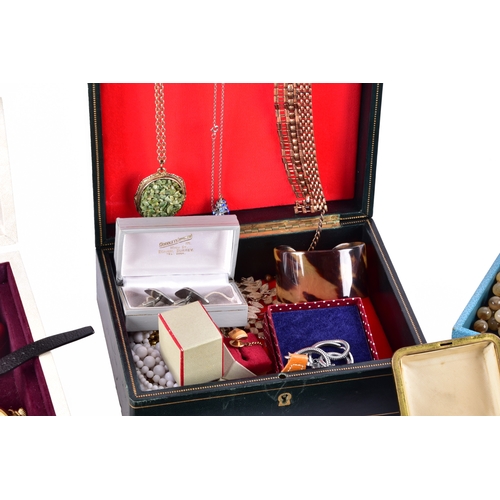 48 - A large collection of costume jewellery, cufflinks, brooches, watches, tie clips, travel clocks, nec... 