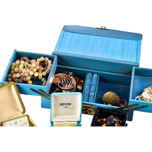 48 - A large collection of costume jewellery, cufflinks, brooches, watches, tie clips, travel clocks, nec... 