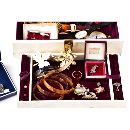 48 - A large collection of costume jewellery, cufflinks, brooches, watches, tie clips, travel clocks, nec... 