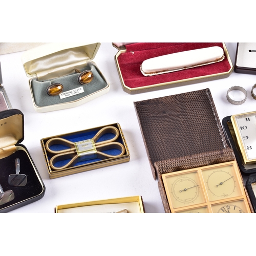 48 - A large collection of costume jewellery, cufflinks, brooches, watches, tie clips, travel clocks, nec... 