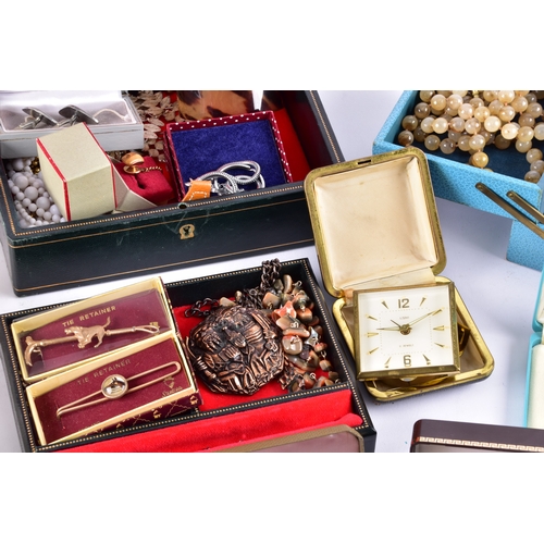 48 - A large collection of costume jewellery, cufflinks, brooches, watches, tie clips, travel clocks, nec... 
