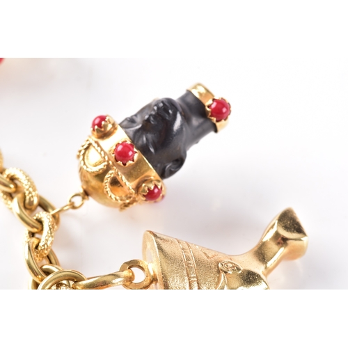 27 - An 18ct yellow gold charm bracelet, with alternating smooth and textured links, suspended with nine ... 