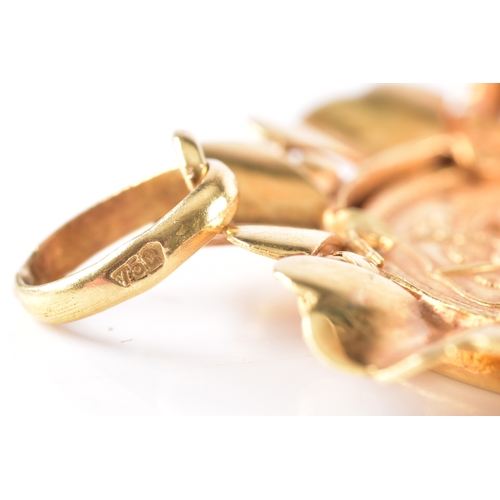 31 - A Saudi Arabian gold guinea coin, set in a 18ct yellow gold pendant/brooch mount, 3.5 cm diameter.