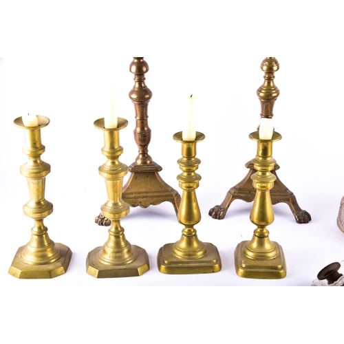 342 - A collection of decorative arts including a pair of large brass altar candlesticks, with turned stem... 