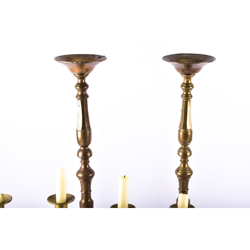 342 - A collection of decorative arts including a pair of large brass altar candlesticks, with turned stem... 
