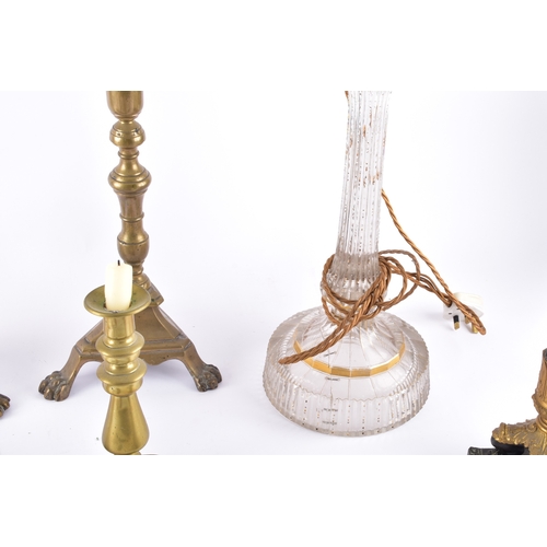 342 - A collection of decorative arts including a pair of large brass altar candlesticks, with turned stem... 