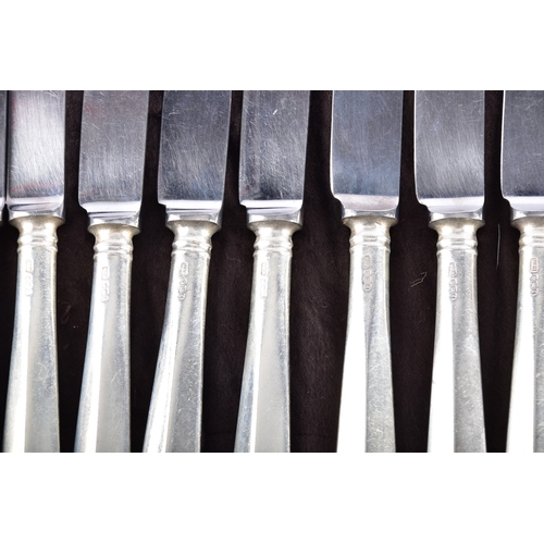 188 - A large collection of silver handled knives, including twenty-four tapered silver handled table kniv... 